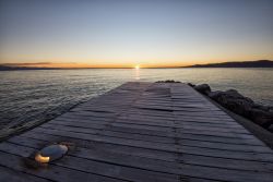 Alba a Padenghe sul Garda fotografata dal molo del porticciolo