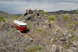 Il trenino della Circumetnea, la linea ferroviaria che si muove tra le pendici dell'Etna è una delle attrazioni di Piedimonte Etneo - © Lucky Team Studio / Shutterstock.com