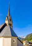 Particolare del campanile di una chiesa nel centro di Pozza di Fassa, Trentino Alto Adige.
