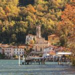 Uno scorcio del lago di Lugano con la chiesa di Sant'Ambrogio sullo sfondo, Porto Ceresio (Varese).
