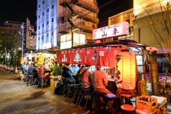 La zona di Tenjin fotografata di notte a Fukuoka, Giappone. E' la città più popolosa dell'isola di Kyushu - © TungCheung / Shutterstock.com