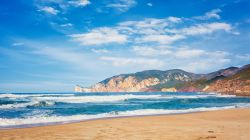 La spiaggia di Porto Paglia (Gonnesa) con la costa ovest della Sardegna sullo sfondo.



