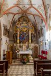 Interno del monastero di San Romedio con altare e affreschi, località Predaia, Trentino Alto Adige - © Luca Mentasti / Shutterstock.com