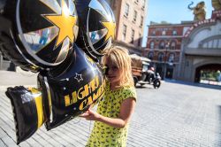 Cinecittà World, Roma: una bambina con un pallonicino a forma di telecamera. Aperto al pubblico il 24 Luglio 2014, questo parco tematico è dedicato al cinema e alla televisione.
 ...