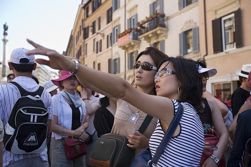 Two japanese tourists visiting in Piazza Spagna Rome, Italy